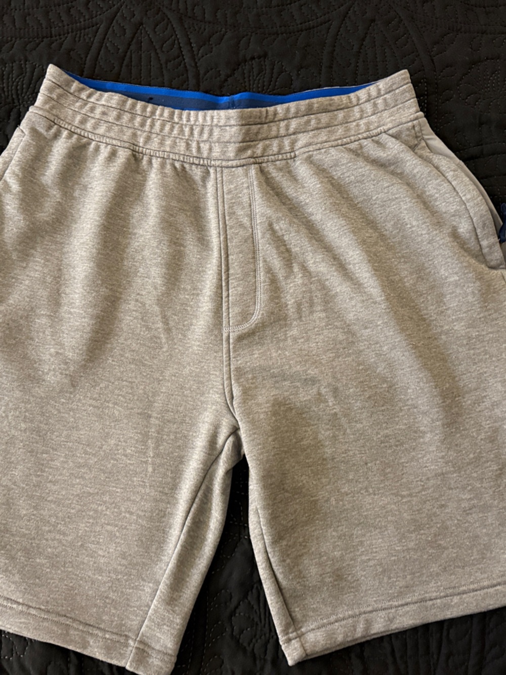 Under Armour Men’s Light Gray Athletic Shorts with Blue Waistband